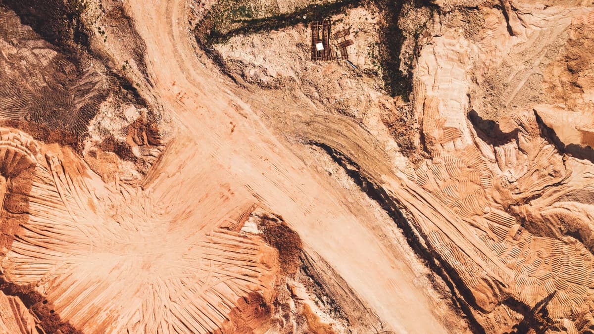 aerial view of construction site with red dirt