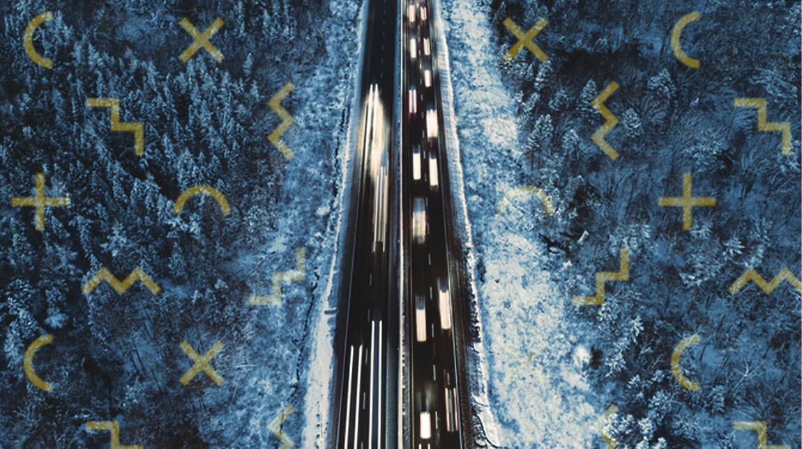 aerial view of a bridge with cars on it above the ocean