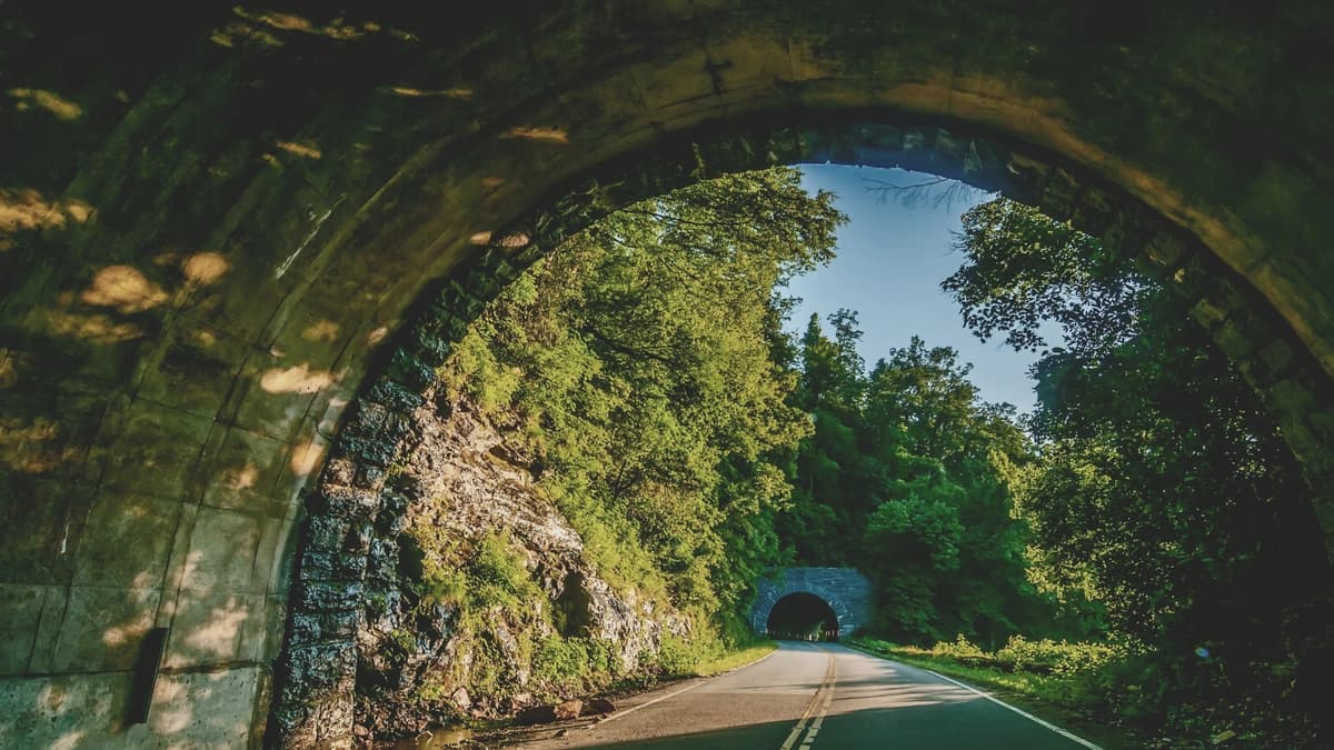 driving out of a tunnel and seeing another tunnel in the middle if a mountain