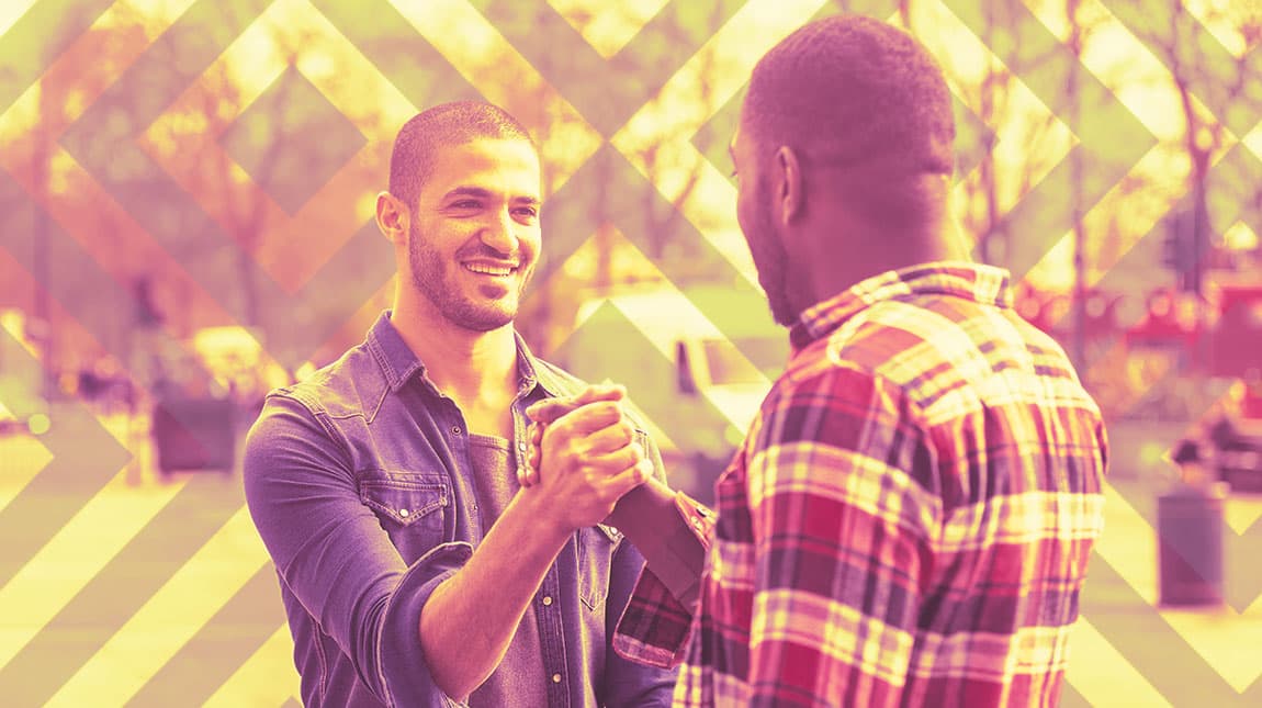 two men greeting eachother