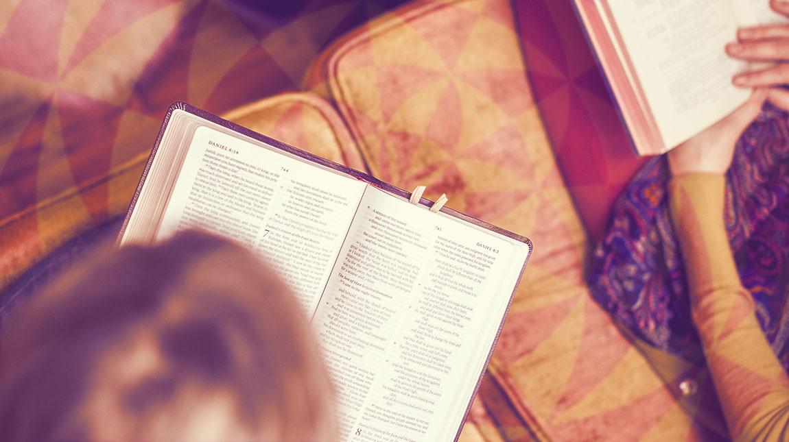 aerial view of man reading Bible